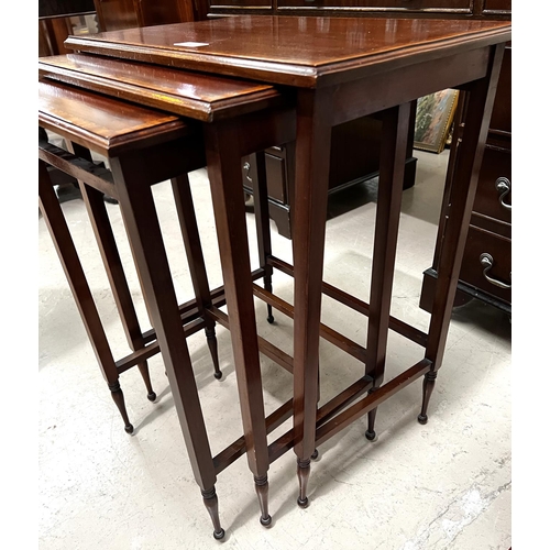 989 - A nest of 3 Edwardian mahogany occasional tables with satinwood crossbanding and square legs