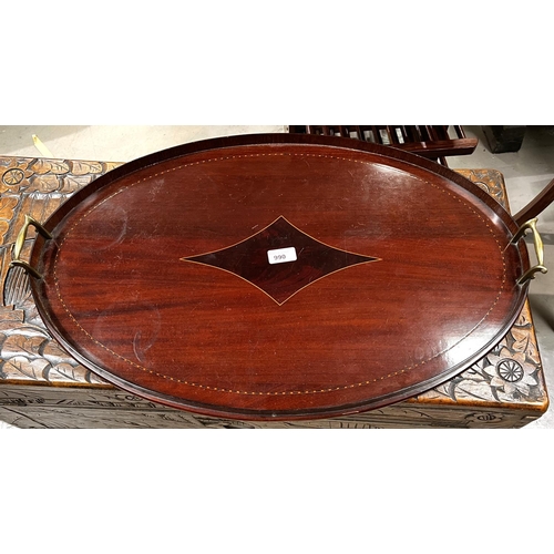 990 - An oval inlaid mahogany tray with brass side handles