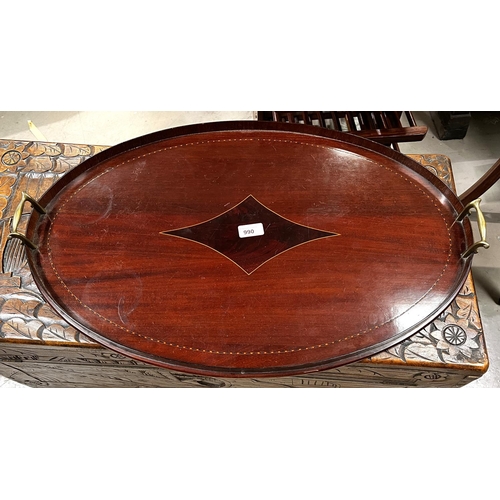 990 - An oval inlaid mahogany tray with brass side handles