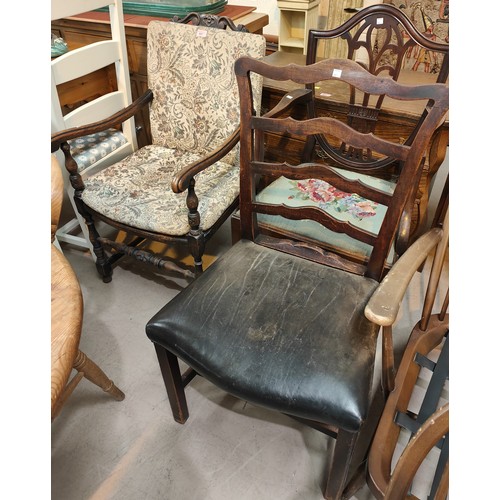 997 - An oak armchair with tapestry upholstery, two traditional dining chairs