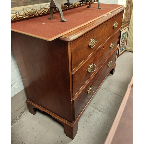 953 - A 19th Century mahogany three height chest of drawers with brass drop handles and bracket feet.