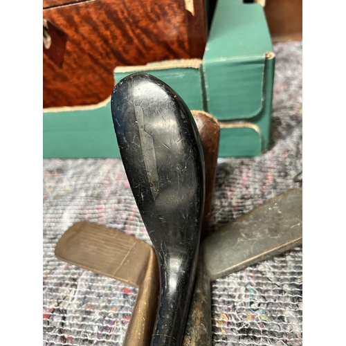 137 - 4 unusual vintage golf clubs inc. two double sided clubs