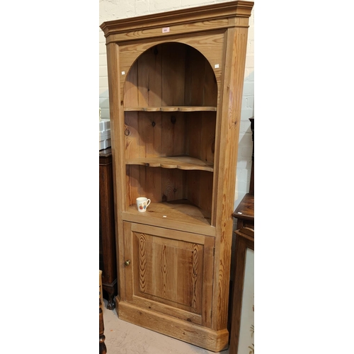 936 - A reproduction pine full height corner cupboard with 3 open shelves and cupboard below