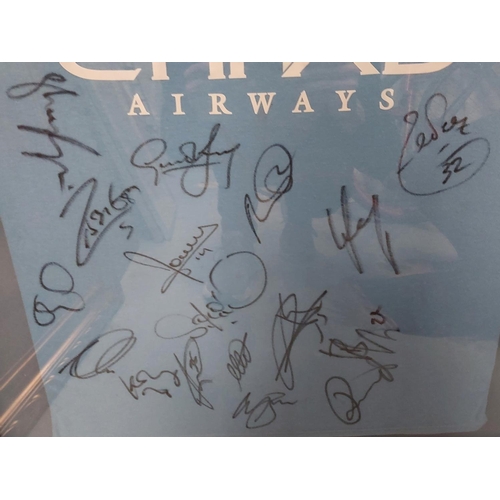 101 - A framed MCFC shirt signed by members of the 2009 / 2010 First Team, with MCFC certificate of authen... 