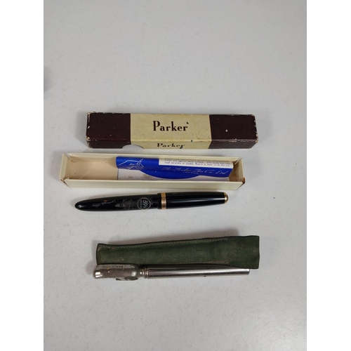 126 - A vintage Parker and a vintage Swan fountain pen, other pens/silver pencils.