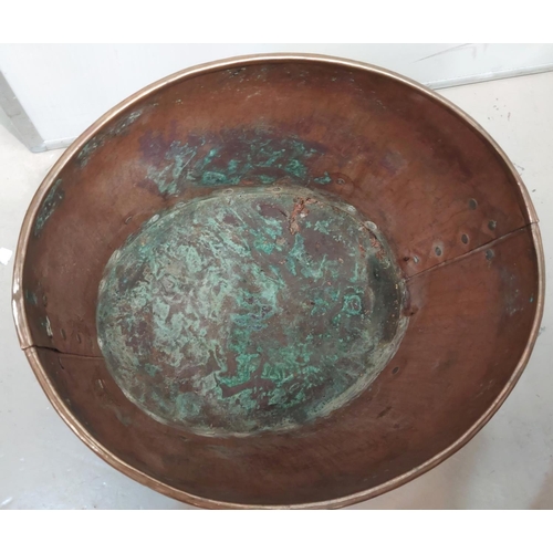 136 - An oval copper log box with brass lion mark handles and and paw feet.