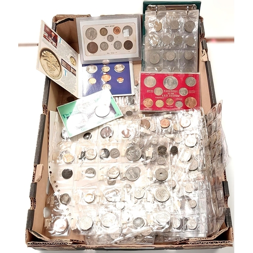 211 - A selection of various coins in folders and an album; a 1984 uncirculated set of GB coins.