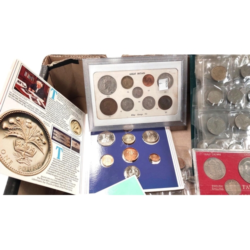 211 - A selection of various coins in folders and an album; a 1984 uncirculated set of GB coins.