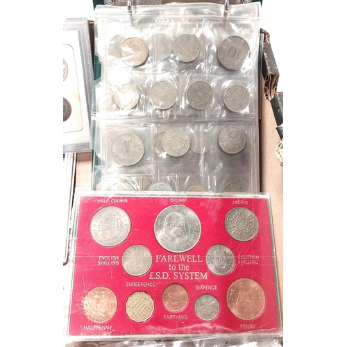 211 - A selection of various coins in folders and an album; a 1984 uncirculated set of GB coins.