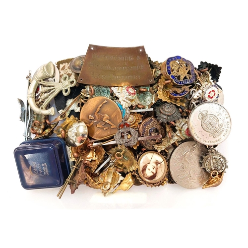 234 - A quantity of military and other badges.