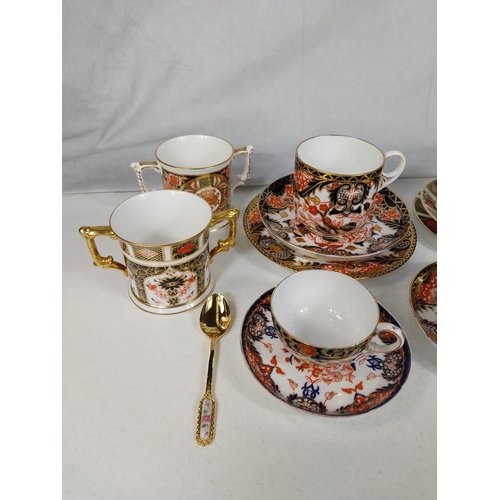 536 - 2 Royal Crown Derby trio sets, 2 loving cups and two cups and saucers, various designs.