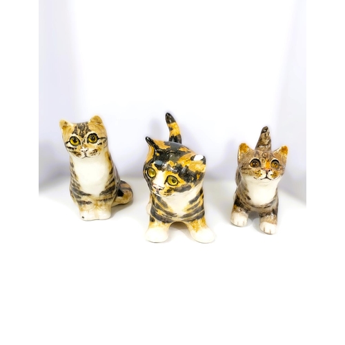 557 - Three Winstanley kittens, all with glass eyes, 2 standing, one seated, 2 size 1, one size 2 (this ha... 