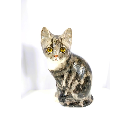 562 - A Winstanley cat, glass eyes, seated, size 4