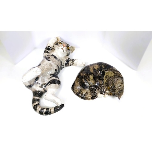 566 - A Winstanley cat, glass eyes, lying on its back, size 4 (arm a.f. but present); A Winstanley cat, gl... 