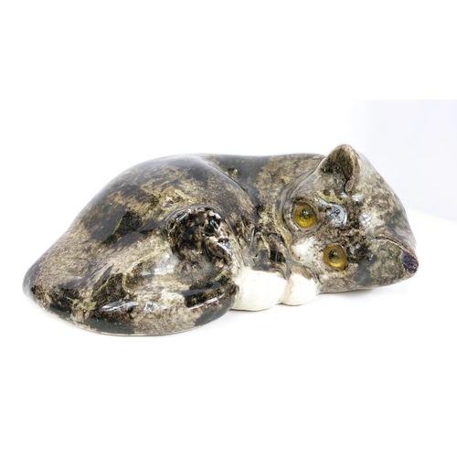 566 - A Winstanley cat, glass eyes, lying on its back, size 4 (arm a.f. but present); A Winstanley cat, gl... 