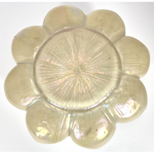 587 - An Art Nouveau period iridescent white glass flower of regular 8 - lobed form, 21cm wide