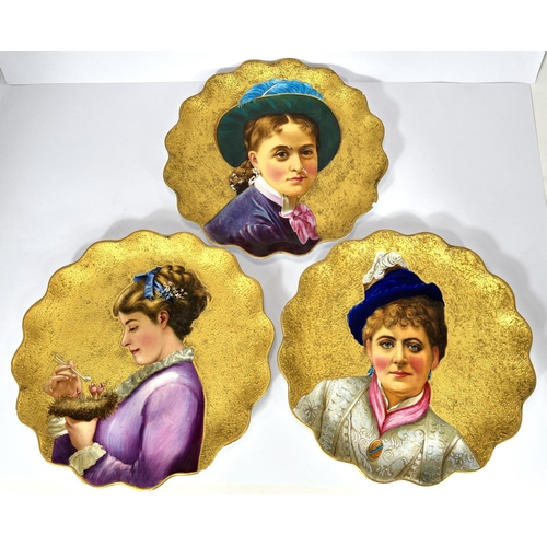 589 - A set of 3 Victorian porcelain cabinet plates decorated with hand enamelled portraits, raised gilt b... 