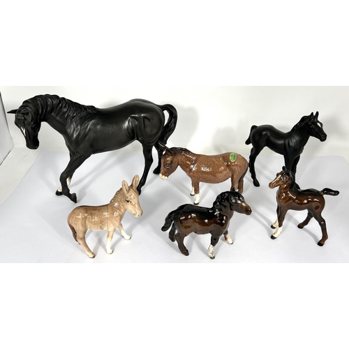 602 - A Beswick matt Black Beauty and foal, a Beswick Donkey and foal and 2 other Beswick horses