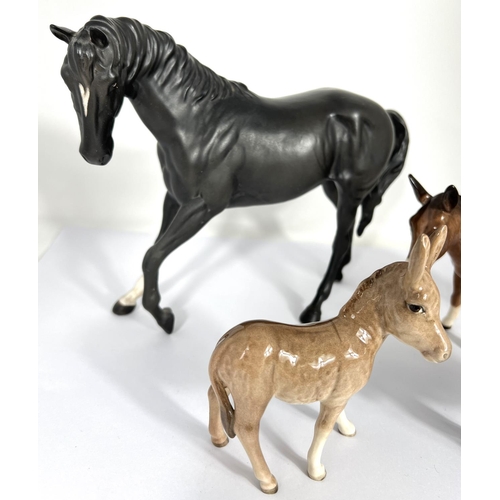 602 - A Beswick matt Black Beauty and foal, a Beswick Donkey and foal and 2 other Beswick horses