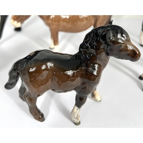 602 - A Beswick matt Black Beauty and foal, a Beswick Donkey and foal and 2 other Beswick horses