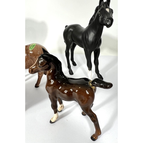 602 - A Beswick matt Black Beauty and foal, a Beswick Donkey and foal and 2 other Beswick horses