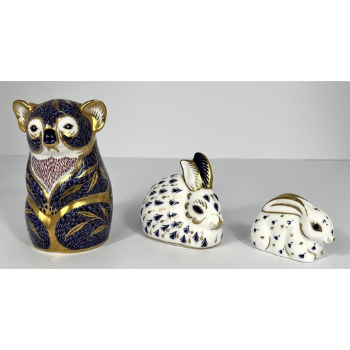 617 - A Royal Crown Derby paperweight Koala LIV, a rabbit LV, a rabbit LVI, all with stoppers