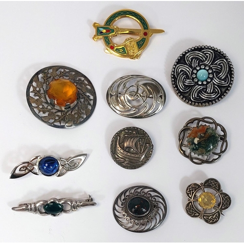 661 - 10 brooches of Celtic design including Edinburgh hallmarked silver circular brooch with Viking ship,... 