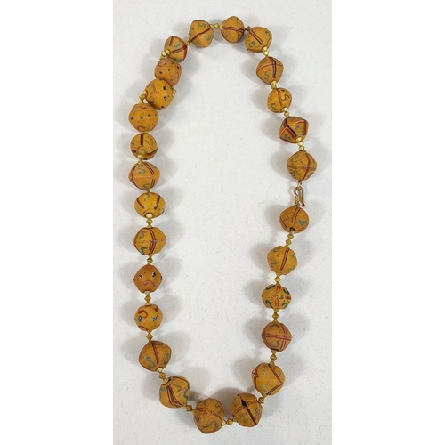 666 - Three Asian bead necklaces, with stones, with carved details and coloured beads etc.