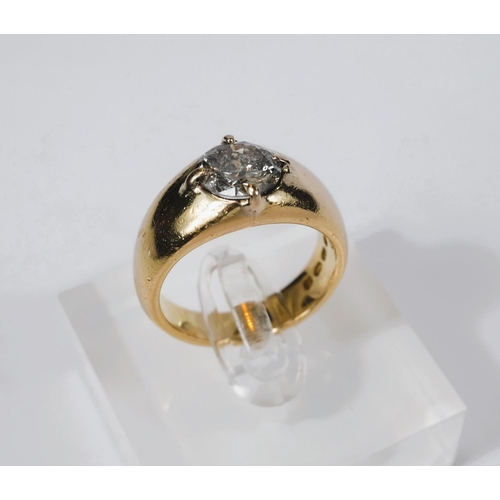 667 - A heavy 18 carat hallmarked gold dress ring with broad shank set large circular diamond, diameter ap... 