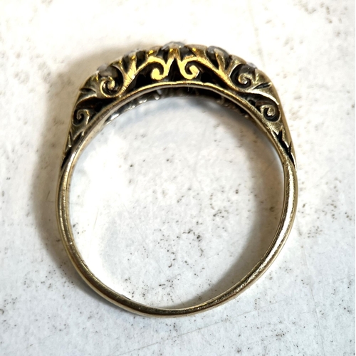 681 - A Victorian child size ring with unmarked yellow metal shank with 5 old cut diamonds in ornate split... 