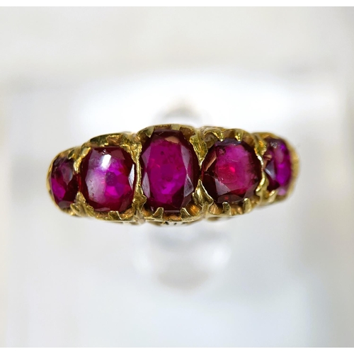 683 - A yellow metal dress ring set with 5 graduating rubies in the Victorian style, split shank setting, ... 