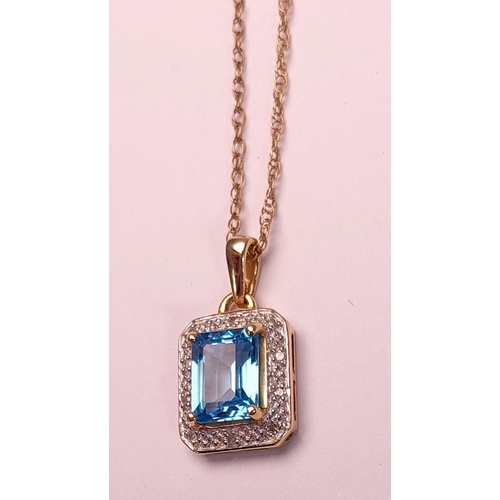 718 - A canted rectangular pendant set with a central cushion cut blue topaz surrounded by illusion set di... 