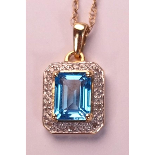 718 - A canted rectangular pendant set with a central cushion cut blue topaz surrounded by illusion set di... 