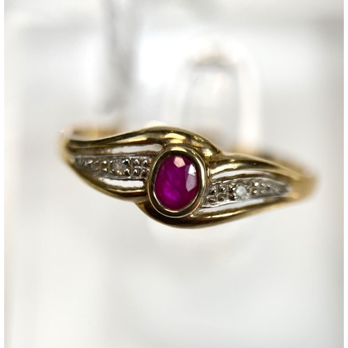 719 - A 9 carat hallmarked gold ring set with an oval ruby and illusion set diamonds, 1.7 gm, size 'R'.