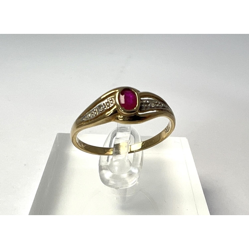 719 - A 9 carat hallmarked gold ring set with an oval ruby and illusion set diamonds, 1.7 gm, size 'R'.