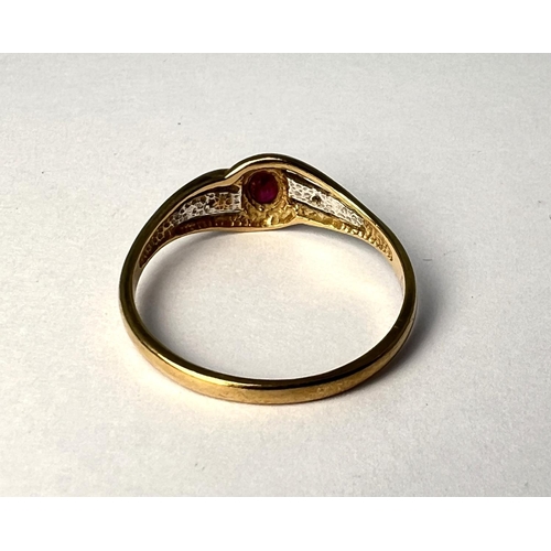 719 - A 9 carat hallmarked gold ring set with an oval ruby and illusion set diamonds, 1.7 gm, size 'R'.