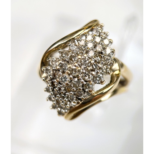 720 - A 9 carat hallmarked ring set with five rows of small diamonds in raised crossover setting,  4.... 