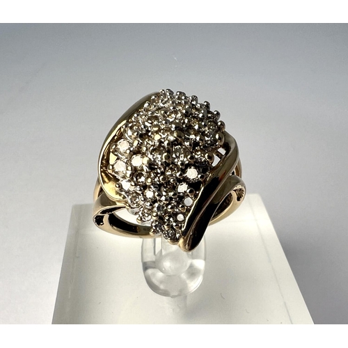 720 - A 9 carat hallmarked ring set with five rows of small diamonds in raised crossover setting,  4.... 