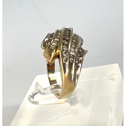 726 - A yellow metal dress ring stamped 10K, set with 5 alternating, rows of circular and square cut diamo... 