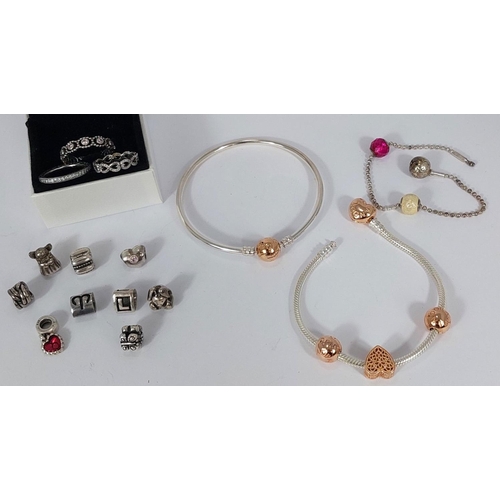 728 - Two Pandora Moments bracelets with gold plated charms; another Pandora bracelet with lock and 2 char... 