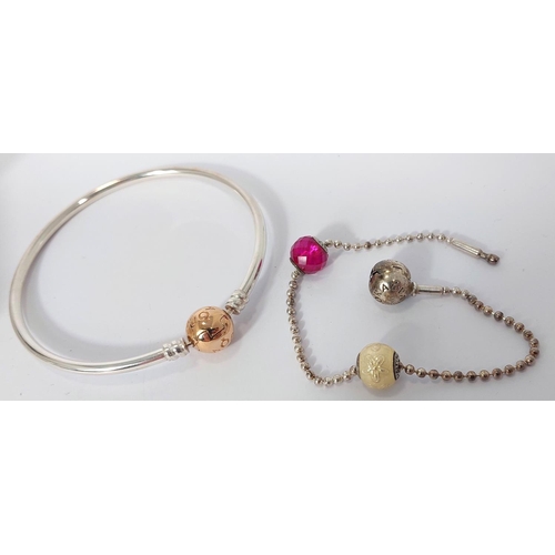 728 - Two Pandora Moments bracelets with gold plated charms; another Pandora bracelet with lock and 2 char... 