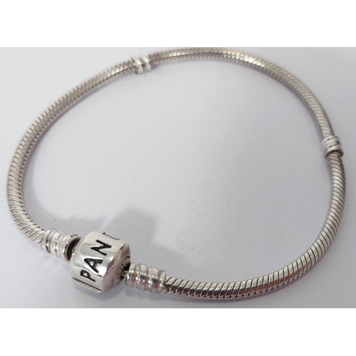 729 - A silver Pandora snake bracelet with 7 glass charms and 9 silver charms; a reticulated Pandora silve... 