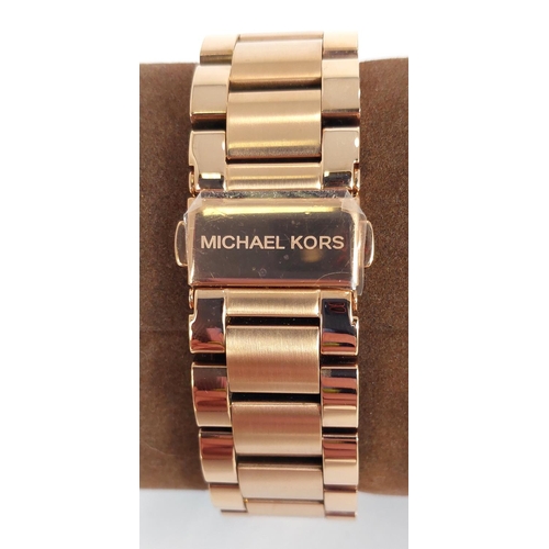 730 - A Michael Kors Blair Chronograph watch, rose gold colour with diamante bezel, original box, no MK526... 