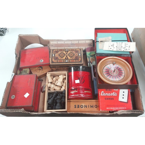 74 - A wooden chess set, dominoes and other games, tins and bric-a-brac.