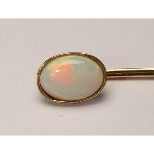 784 - A 19th century yellow metal stock pin set opal cabochon (tests 9ct.) 1.5gm