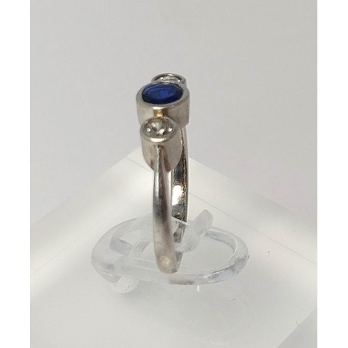 785 - A 1930's white metal ring set sapphire and 2 diamonds (tests 18ct), 3.19gm