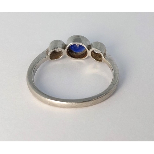 785 - A 1930's white metal ring set sapphire and 2 diamonds (tests 18ct), 3.19gm