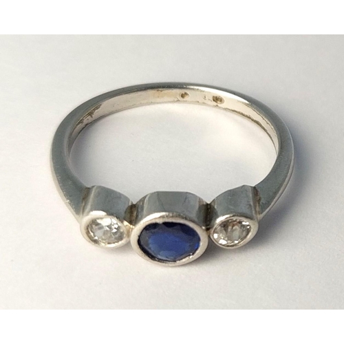 785 - A 1930's white metal ring set sapphire and 2 diamonds (tests 18ct), 3.19gm