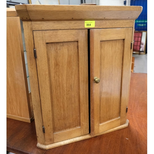 864 - A small pine corner cupboard, double door; a lightwood bedroom chair and a mahogany dining chair wit... 