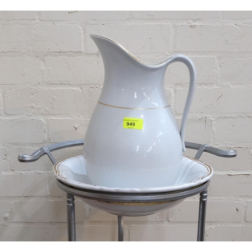 949 - A continental vintage style cast metal washstand, height 81cm; a china jug and bowl